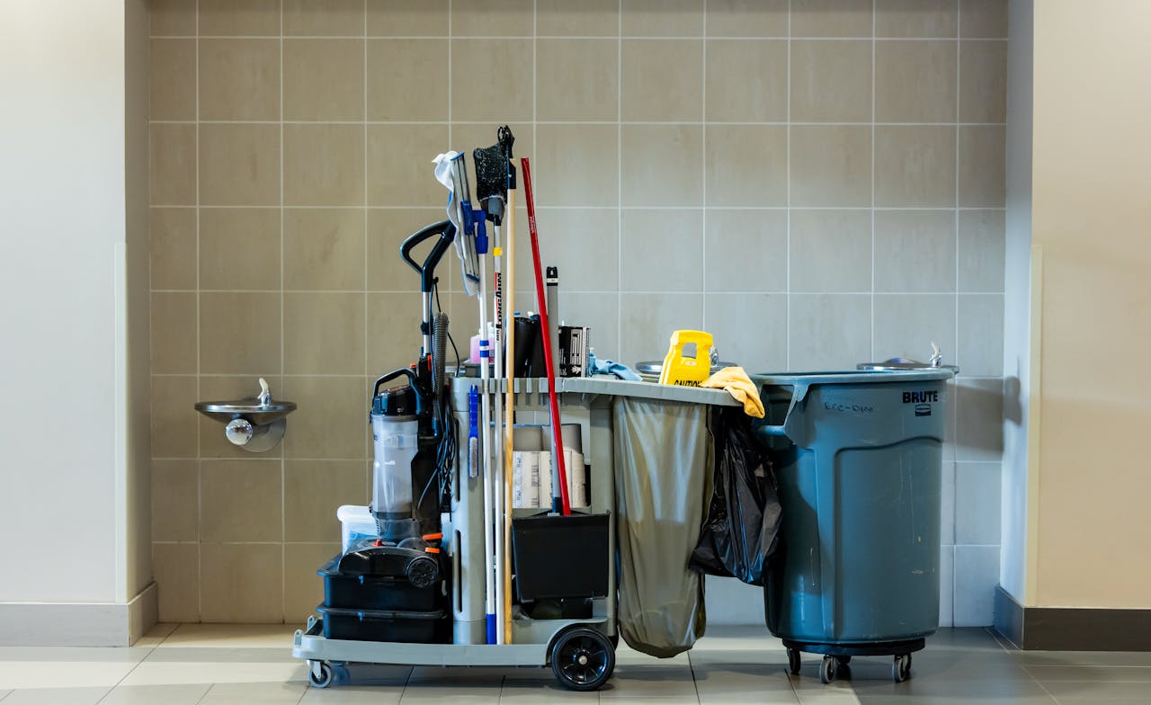 home-hero-bg A comprehensive collection of professional cleaning tools on a cart in an indoor environment.